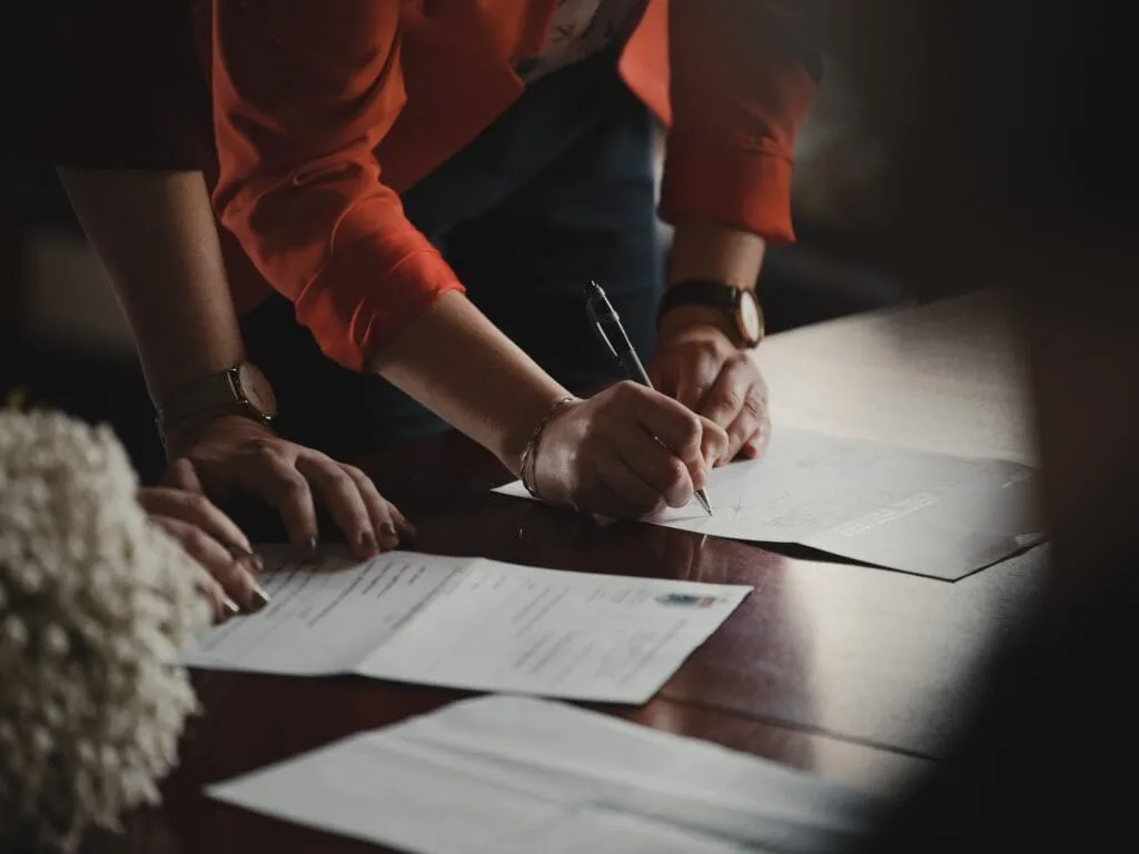Signing legal documents related to criminal contempt charges.
