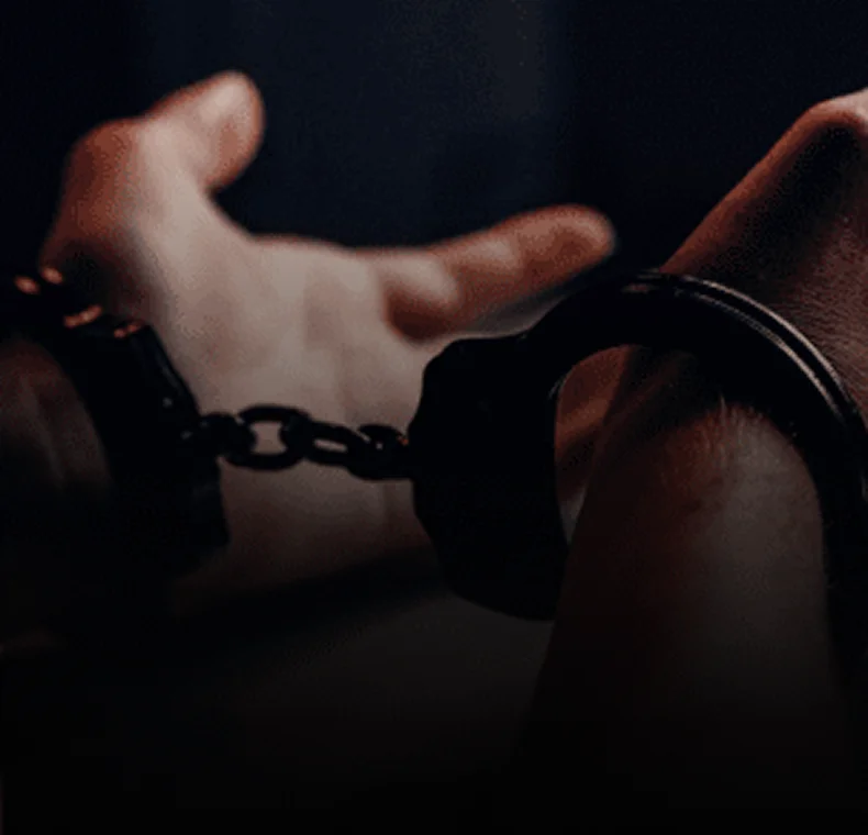 Handcuffed hands, symbolizing legal issues for a sex crimes attorney in Syracuse.
