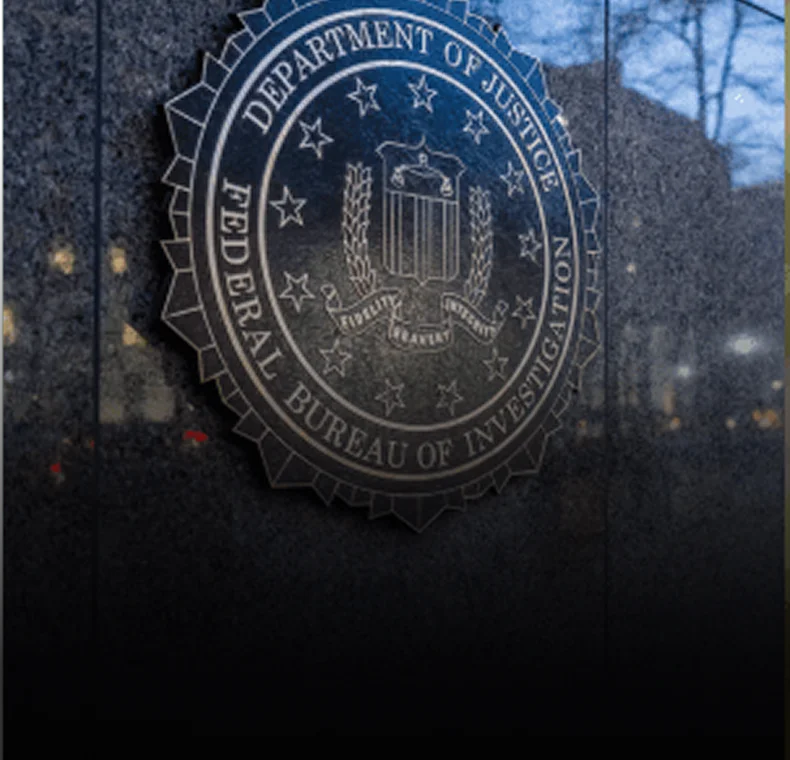 FBI seal on a dark building, representing federal crimes.