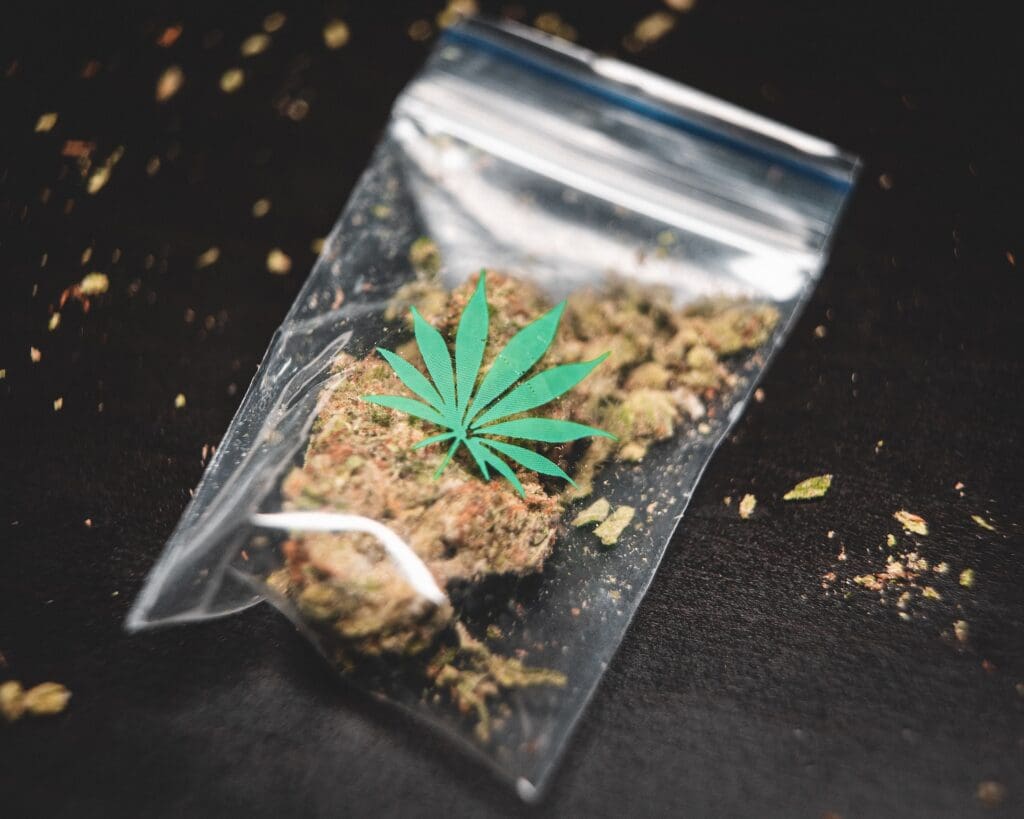 Bag of cannabis with marijuana leaf symbol, relevant to DWAI defense.
