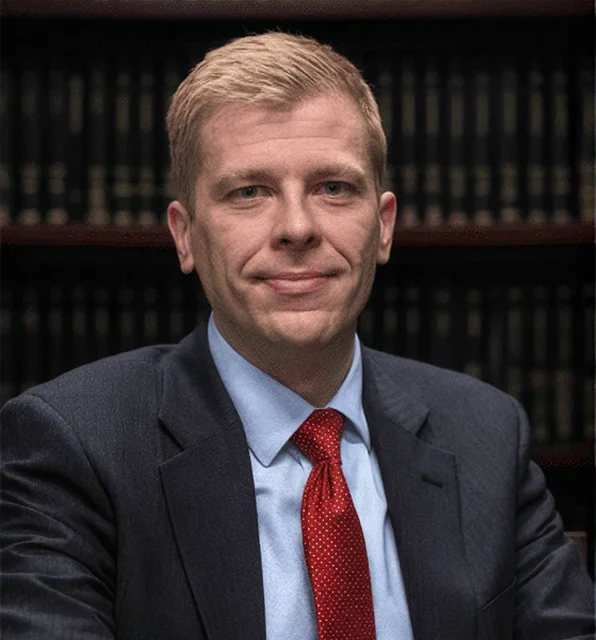 Ken Tyler, chief assistant district attorney, in a suit and tie.